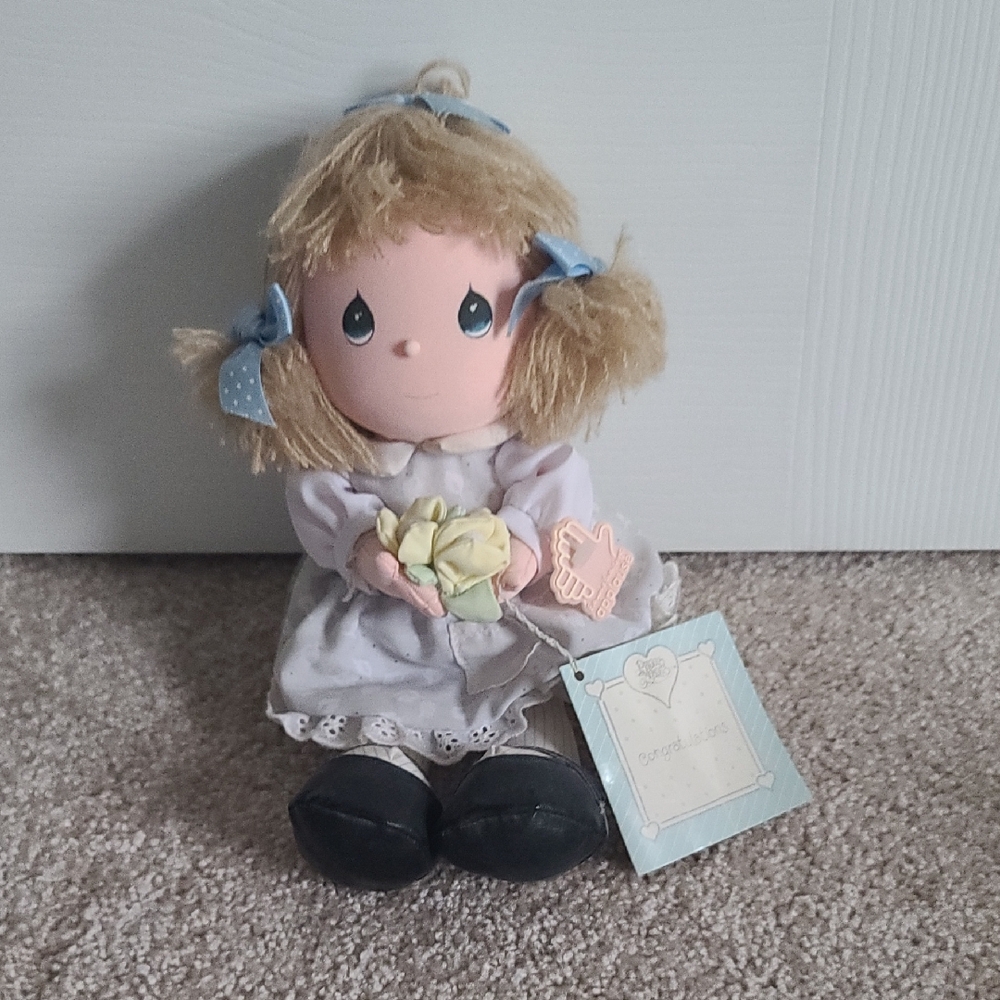 Adorable Doll with Blonde Hair and Blue Accents